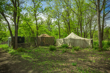 tent camp in a clearing in the forest