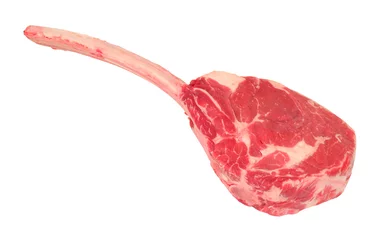 Tuinposter Fresh raw tomahawk beef steak on the bone  matured for thirty days isolated on a white background © philip kinsey