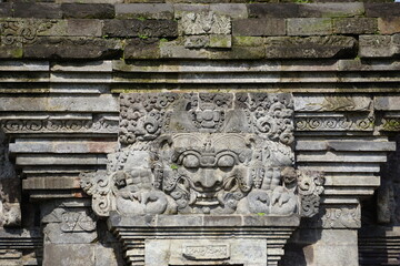 The relief of kala kirtimukha on penataran temple. Kala kīrttimukha is the name of a swallowing fierce monster face with huge fangs and a gaping mouth