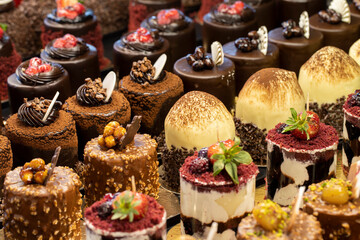 Types of cakes. Delicious cakes in bulk at the patisserie counter. close up