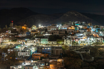 Fototapeta na wymiar Beautiful view of the Mexican city of Guanajuato at night. City surrounded by large mountains.