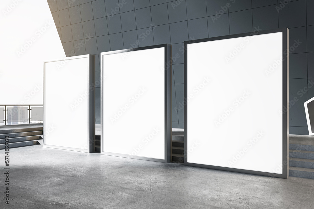 Poster outdoor advertising concept with perspective view on three blank white illuminated billboards with p