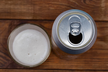 Top view of open beer can on a blurred background