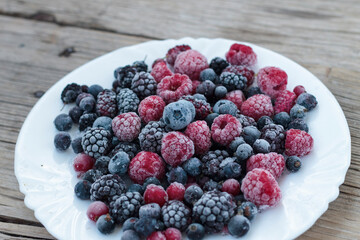 Frozen berries in a bowl, close-up