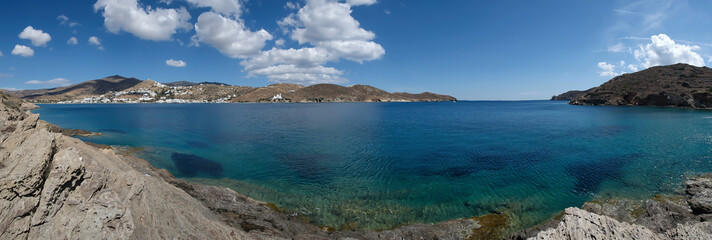 Panoramic view of the beautiful beach of Tzamaria in Ios Greece and the whitewashed village in the background