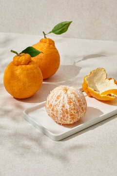 Peeled Hallabong is on a plate.