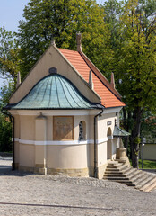 Kalwaria Zebrzydowska, Poland - August 18, 2022: Chapel of St. Raphael in front of 17th century Passion and Marian sanctuary of Bernardine Fathers