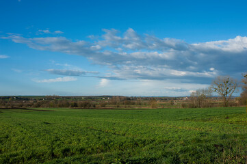 Plowed field under the background of blue sky