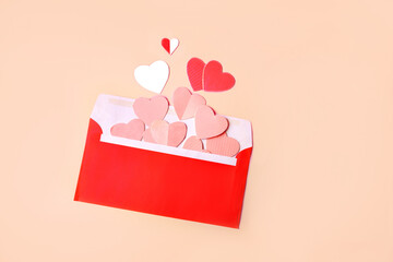 red envelope with pink and red hearts. Greeting card