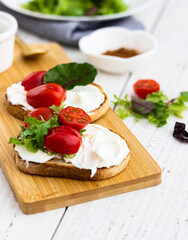 Fototapeta na wymiar Toast with cherry tomatoes and cheese