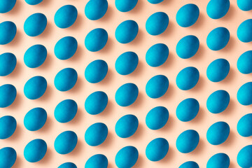 Blue easter eggs flat lay on pink background