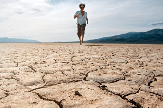 runner on Death Valley parched soil