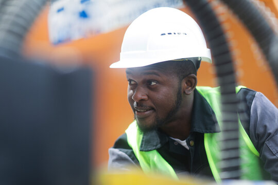 worker young male with helmet outside looking