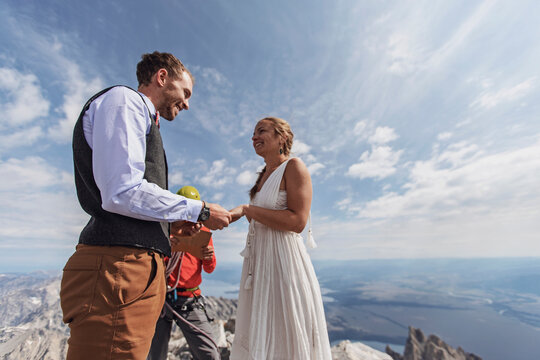 Couple Exchanges Vows And Rings During Wedding On Top Of Mountain