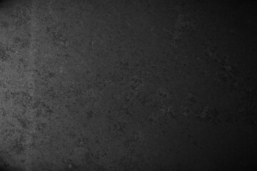 Old black concrete wall tetxure. Dark grunge background
