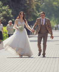 The bride and groom in a wedding dress.