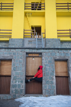 A woman takes in the view at a retro ski lodge in Chile.