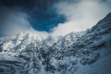 Katahdin’s snowy mountain ridge in dramatic light in winter