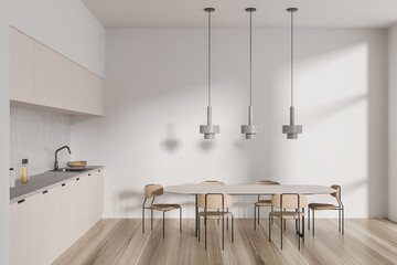 Front view on bright kitchen room interior with dining table