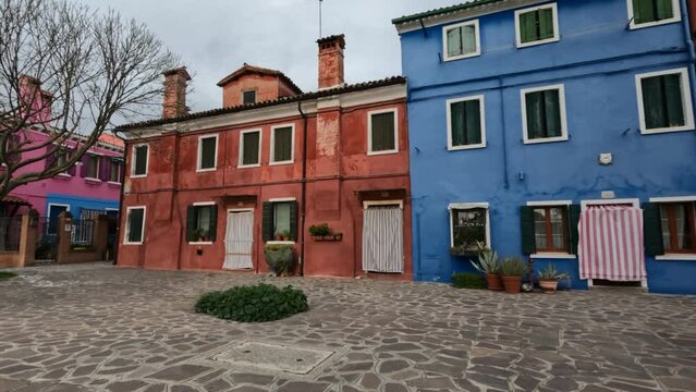 Beautiful painted houses and narrow and ancient alleys on the island of Burano in Venice Italy, winter