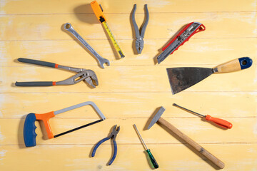 All tools supplies home construction on the yellow wooden background. Building tool repair equipments,copy space,industry engineer tool concept.still-life.