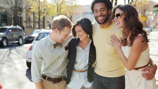 Diverse group laughing in the street