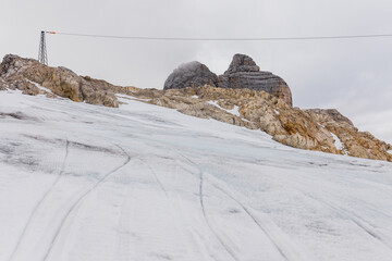 alpine mountain views strewn with snow under a blue sky