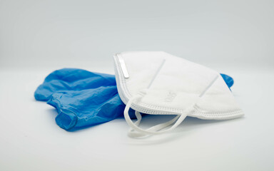 Medical mask and blue gloves, virus and infection protection.