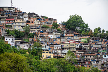 Fototapeta na wymiar Beautiful view to poor favela houses on hill side
