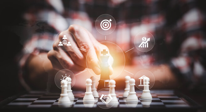 Business strategy competitive ideas concept, Chess game on chess board behind business background. Business present financial and marketing strategy analysis. Investment target in global economy .