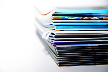 stack of magazines on white background