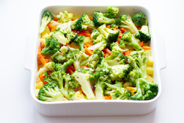 Broccoli, carrots and potatoes in baking dish