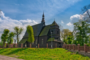 Fototapeta na wymiar Wooden Church of St. Michael the Archangel and St. Mary Magdalene in Domachowo, village in Greater Poland voivodeship. Poland