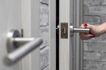 man opens the door to the room.