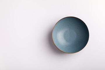 Plate on the white background. blue bowl.