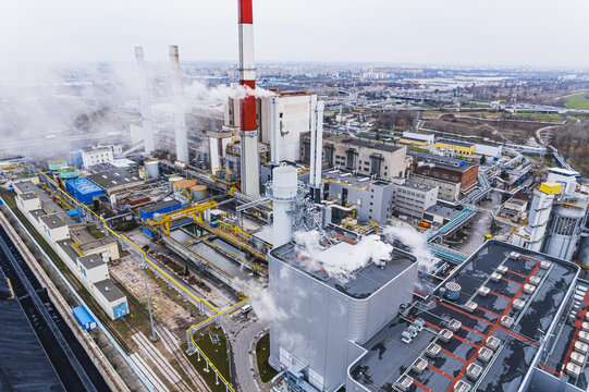 Aerial view of Zeran heat power station with smoke emissions from the chimney in Warsaw, Poland. High quality photo