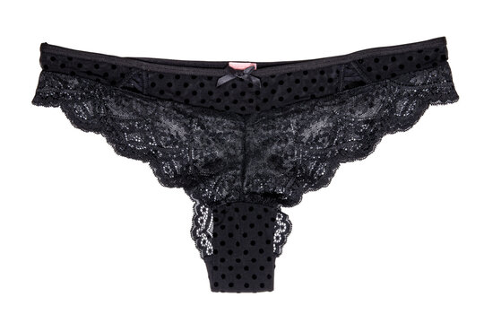 Underwear woman isolated. Close-up of luxurious elegant black lacy thongs panties isolated on a white background. Clipping path. Underwear fashion.