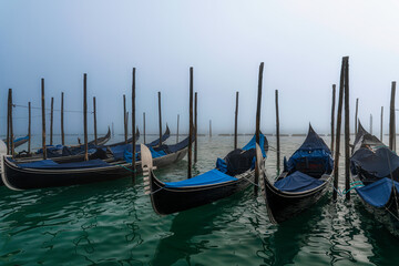 Gondolas at Piazza San Marco on foggy Winterday, Venice, Italy