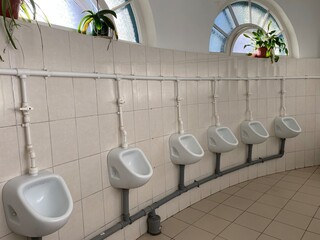 interior. Urinals in a public toilet