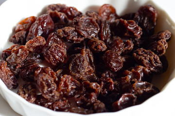 Dried grape on white background.