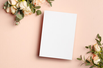 Blank invitation or greeting card mockup with flowers, blank card with copy space