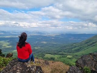 Naklejka premium person on top of mountain