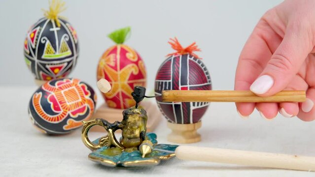 Pysanky are raw eggs painted with beeswax and paints that are given to each other for Easter dip a steel pen into hot wax on a raw cold egg to draw patterns Pen for painting Easter eggs with wax