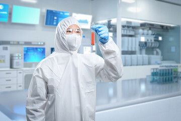 Worker wears medical protective suit or white coverall suit with test tube