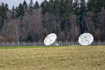 parabolic radio and television antennas for receiving satellite signals.