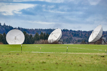 parabolic radio and television antennas for receiving satellite signals.