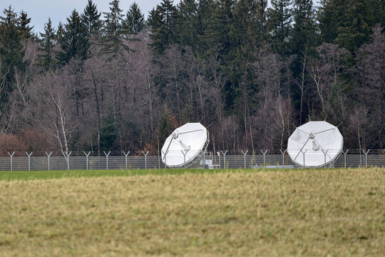 parabolic radio and television antennas for receiving satellite signals.