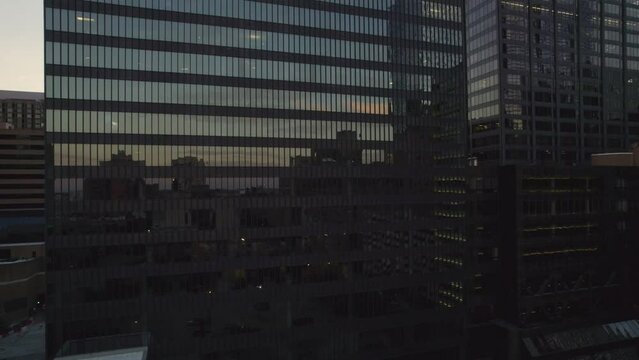 Sky reflections on building in Downtown Houston at dusk