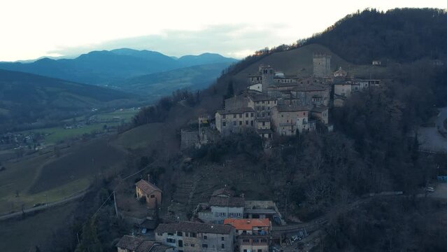 drone aeria sunsetl view of Vigoleno Castle , fortress village and hills, scenic panorama in Parma, Emilia Romagna , Italy.