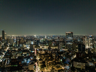Obraz premium Beautiful aerial view of the capital of Mexico city at night.
